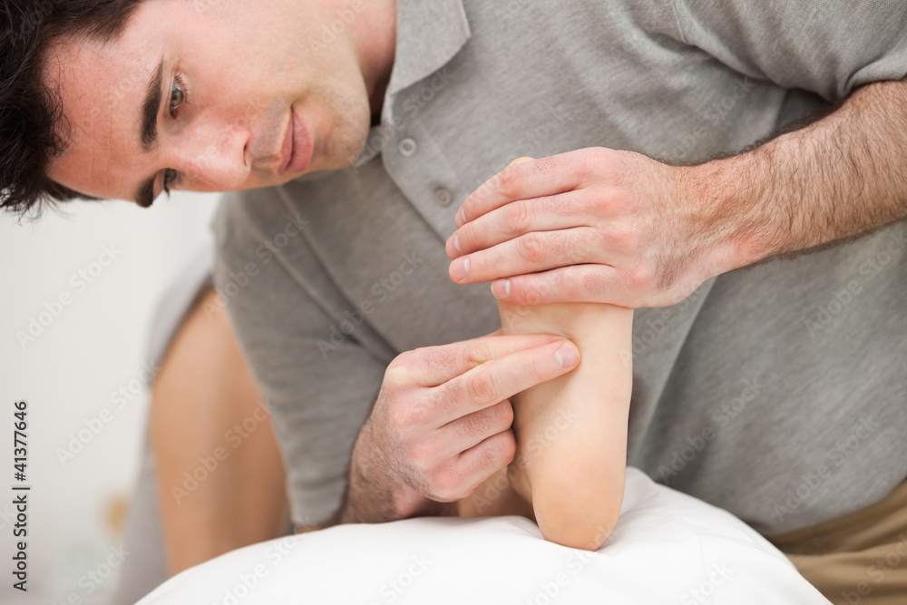 Chiropodist making a foot massage Chiropodist making a foot massage