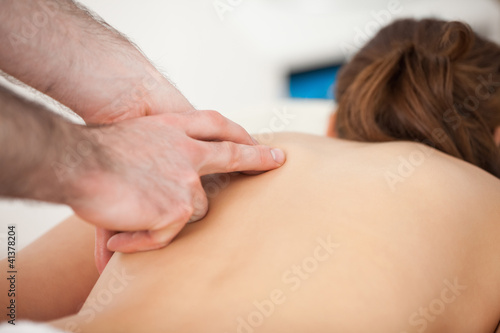 Doctor massaging his patient while using only two fingers