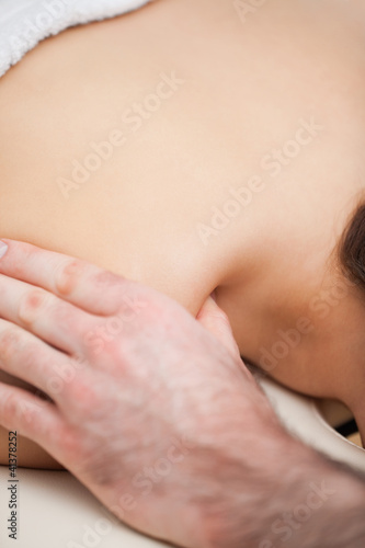 Shoulder of a woman being massaged by a doctor © WavebreakmediaMicro
