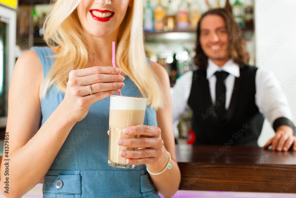 Barista with client in his cafe or coffeeshop Barista with client in his cafe or coffeeshop