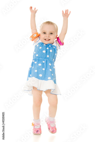 little girl raised her hands up