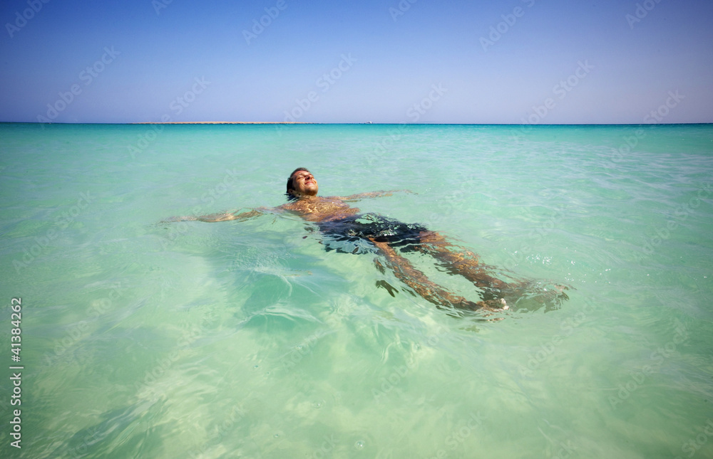 The man relaxing in sea