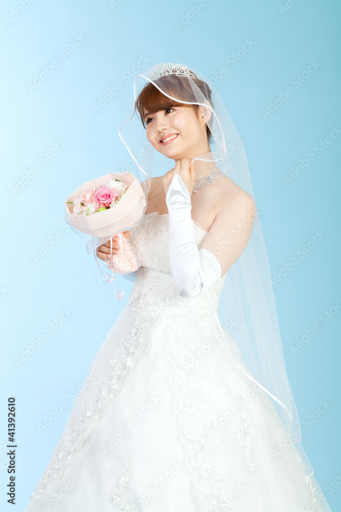 Beautiful asian woman dressed as a bride