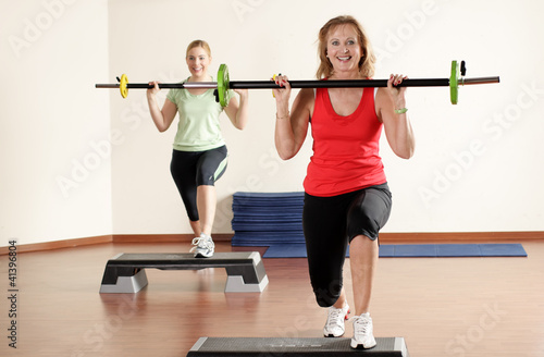 An Elderly woman and a young woman fitness workout