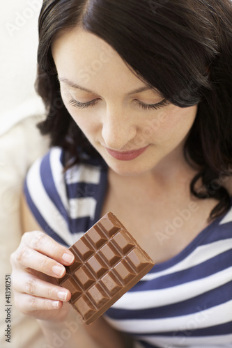 Woman eating chocolate