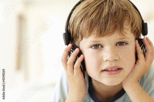 Young boy wearing headphones
