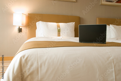 hotel bed and laptop