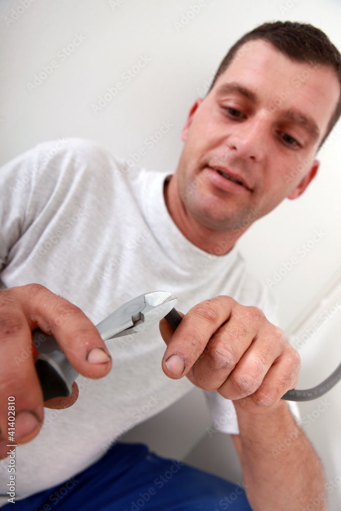 Laborer using pliers