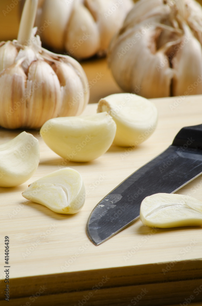 garlic cloves and fruit knife garlic cloves and fruit knife
