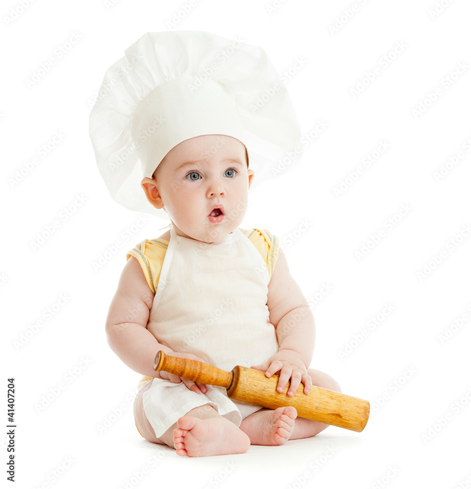 Kid with rolling pin and cook hat isolated Kid with rolling pin and cook hat isolated