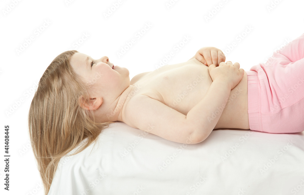 Happy smiling little child lying on a couch Happy smiling little child lying on a couch