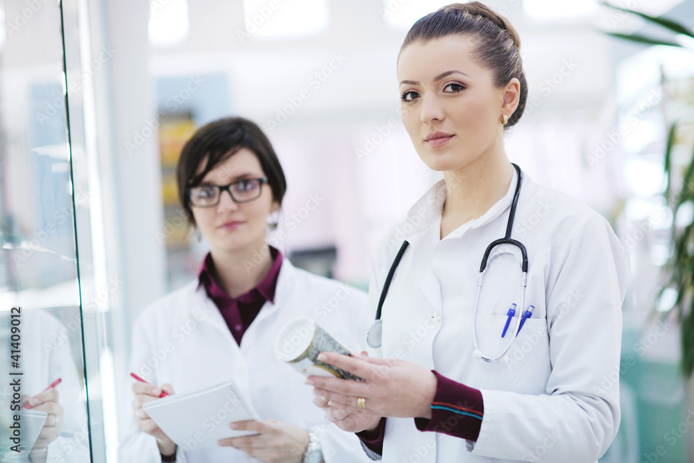team of pharmacist chemist woman in pharmacy drugstore team of pharmacist chemist woman in pharmacy drugstore