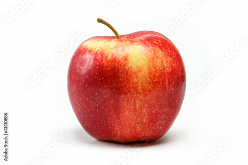 Ripe juicy natural red apple on a white background.