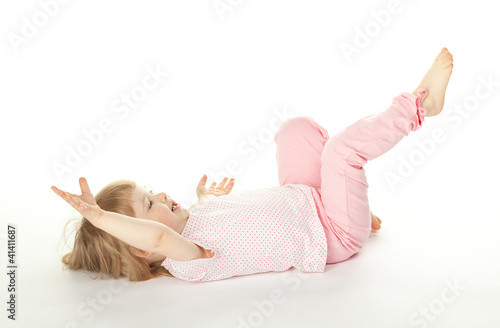 Happy girl having fun on the floor; white background