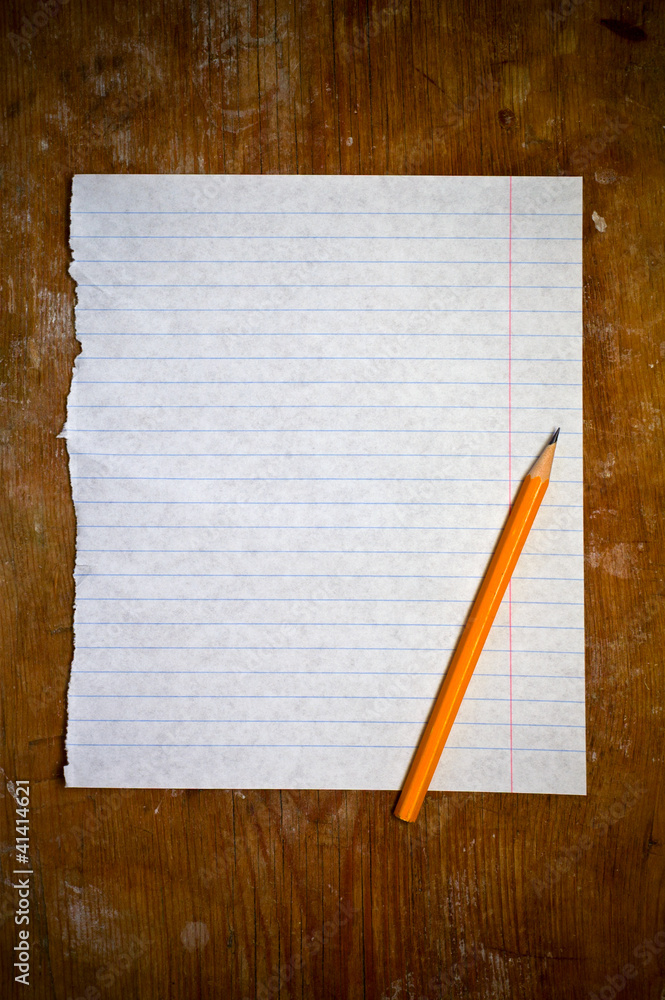paper with pencil on wooden background paper with pencil on wooden background
