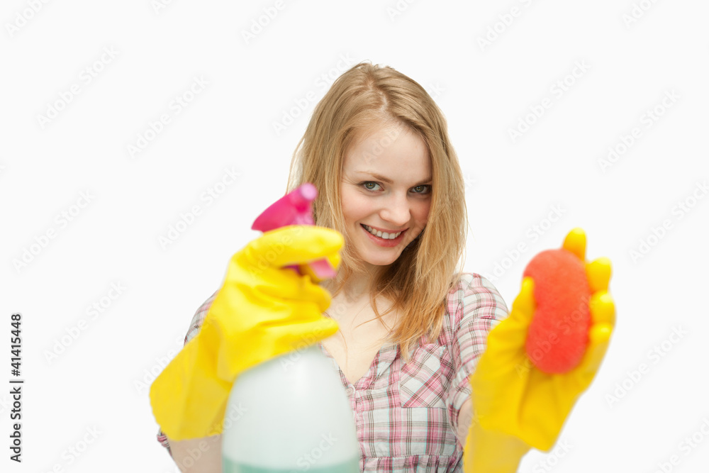 Woman holding cleaning agents Woman holding cleaning agents