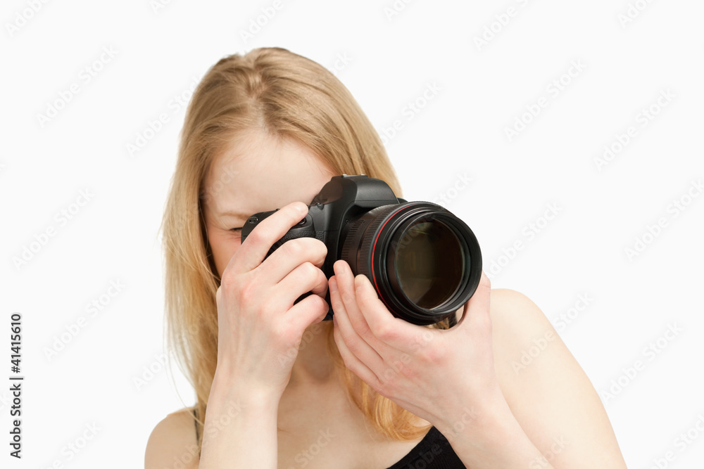 Woman taking a photography with a single-lens reflex camera Woman taking a photography with a single-lens reflex camera
