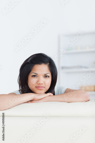 Woman crossing her arms and resting her head on them