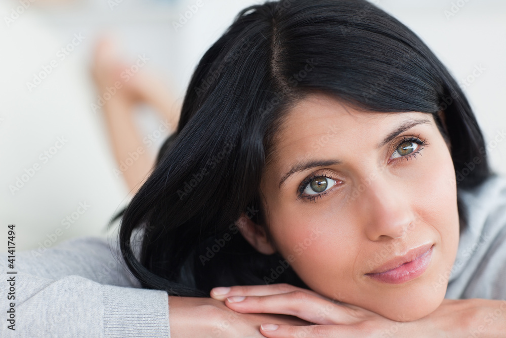 Close-up of a woman lying on a sofa Close-up of a woman lying on a sofa