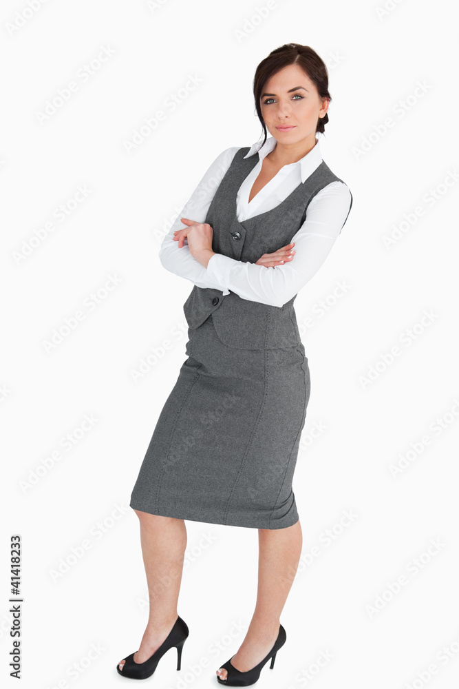 Seductive woman in suit posing with arms folded Seductive woman in suit posing with arms folded