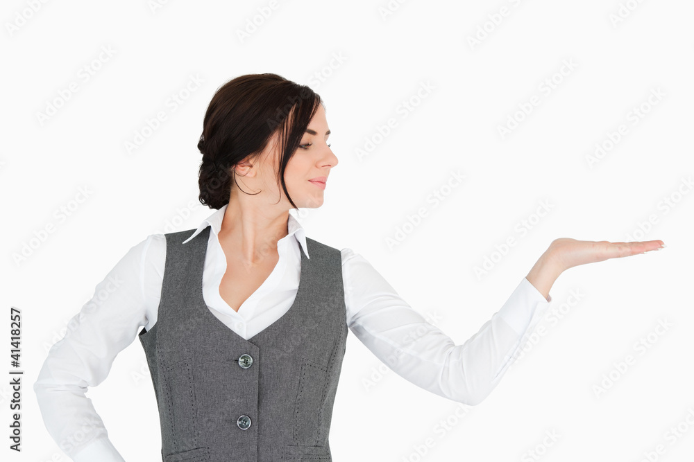Young businesswoman looking at her palm facing up Young businesswoman looking at her palm facing up