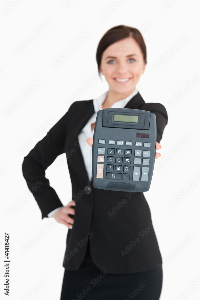 Happy businesswoman in black suit showing a calculator Happy businesswoman in black suit showing a calculator
