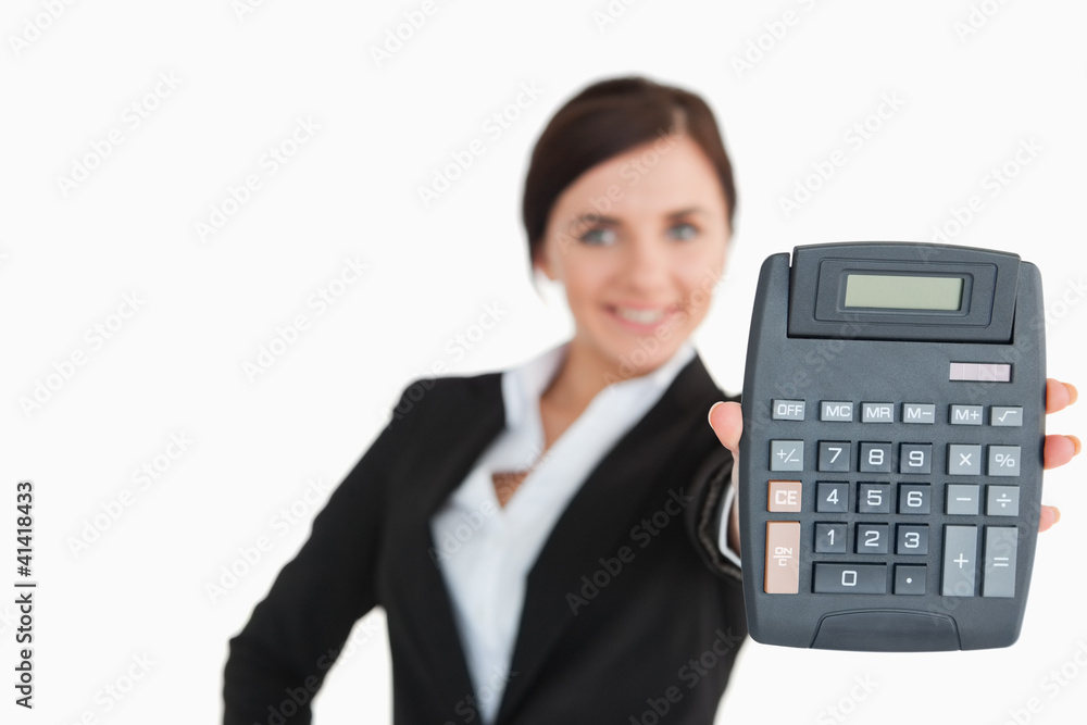 Woman in black suit showing a calculator Woman in black suit showing a calculator