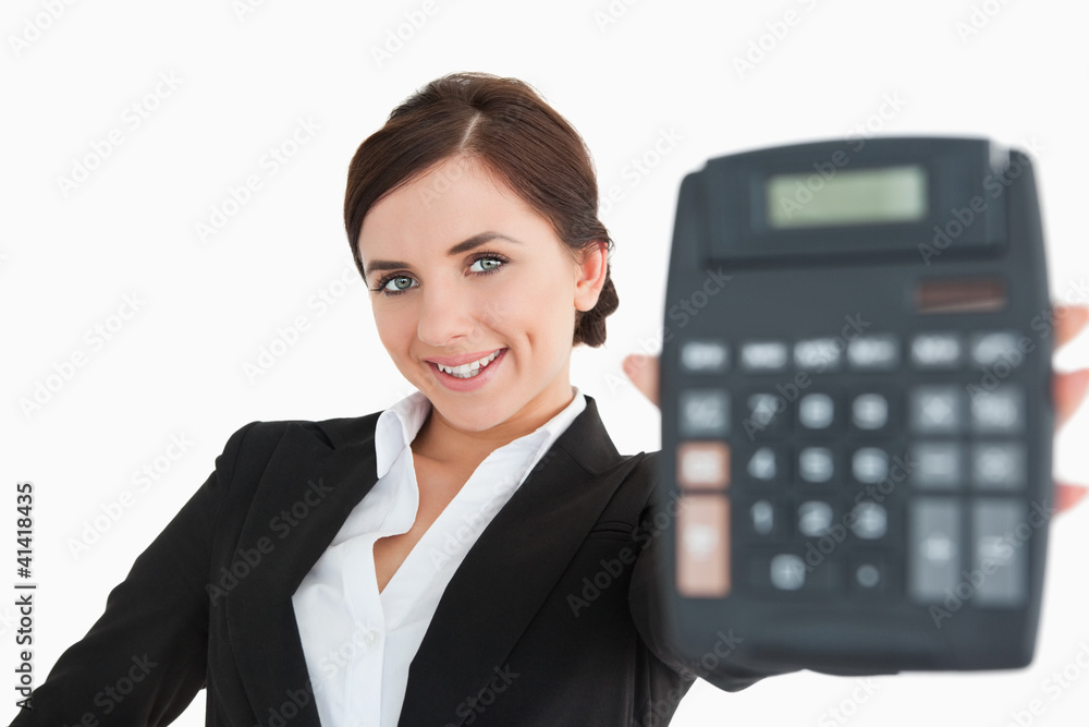 Smiling woman in black suit showing a calculator Smiling woman in black suit showing a calculator