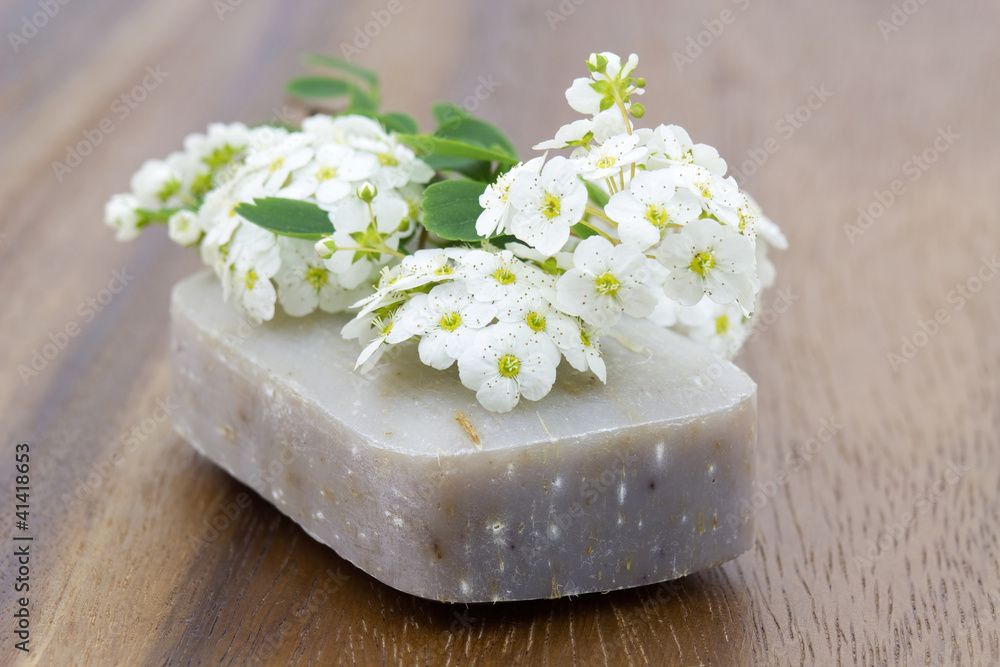 bar of natural soap and white flowers bar of natural soap and white flowers