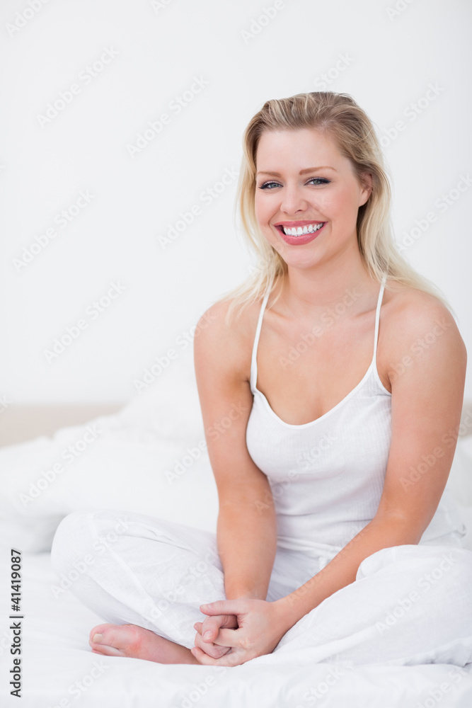 Smiling blonde crossed-legged Smiling blonde crossed-legged