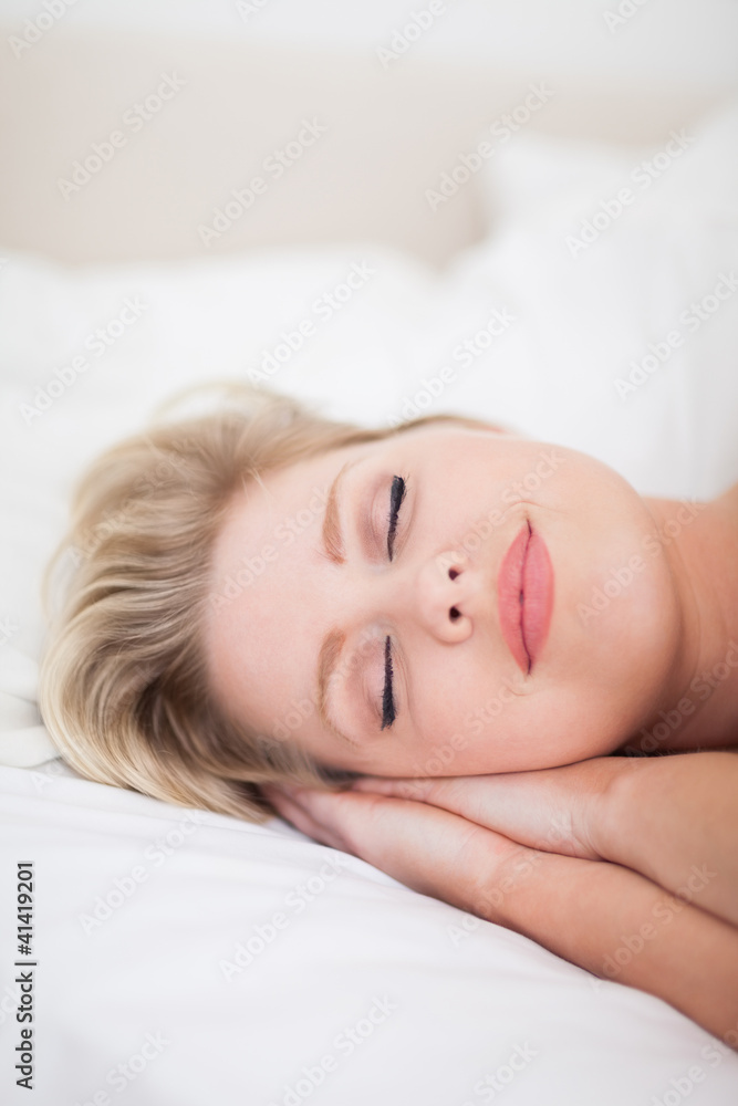 Young woman sleeping with make up on her face