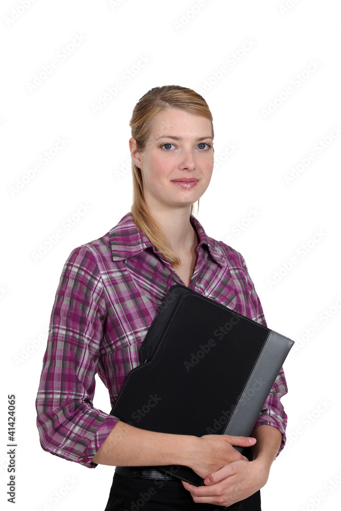 Portrait of a woman holding a folder Portrait of a woman holding a folder
