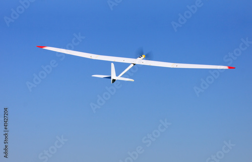 RC glider flying in the blue sky