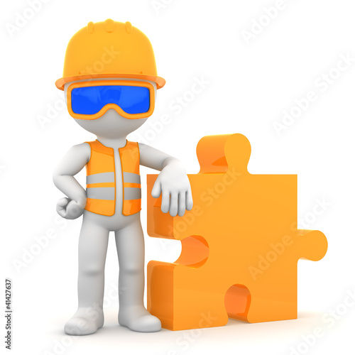 Fototapeta Naklejka Na Ścianę i Meble -  Industrial worker with piece of puzzle. Building concept