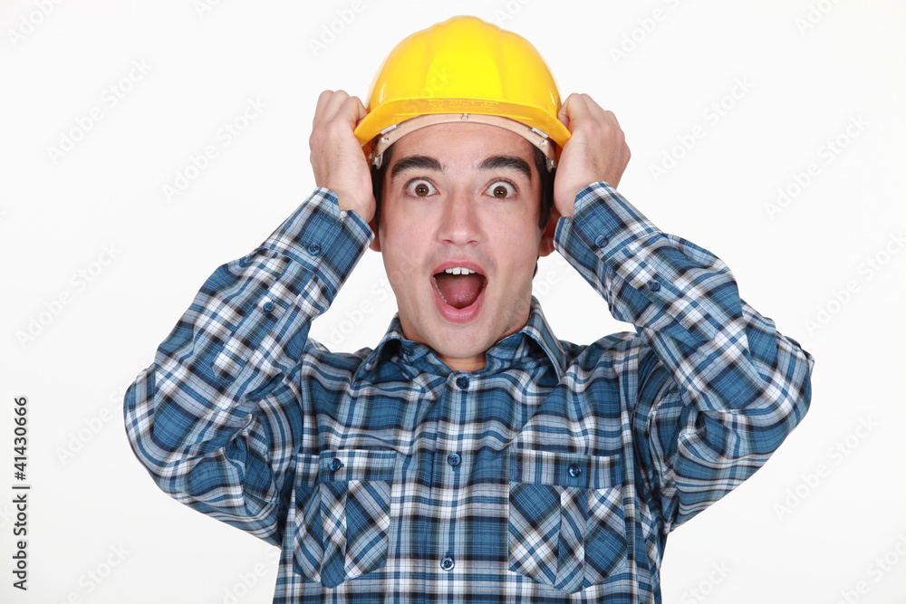 young craftsman shouting with hands to hardhat young craftsman shouting with hands to hardhat