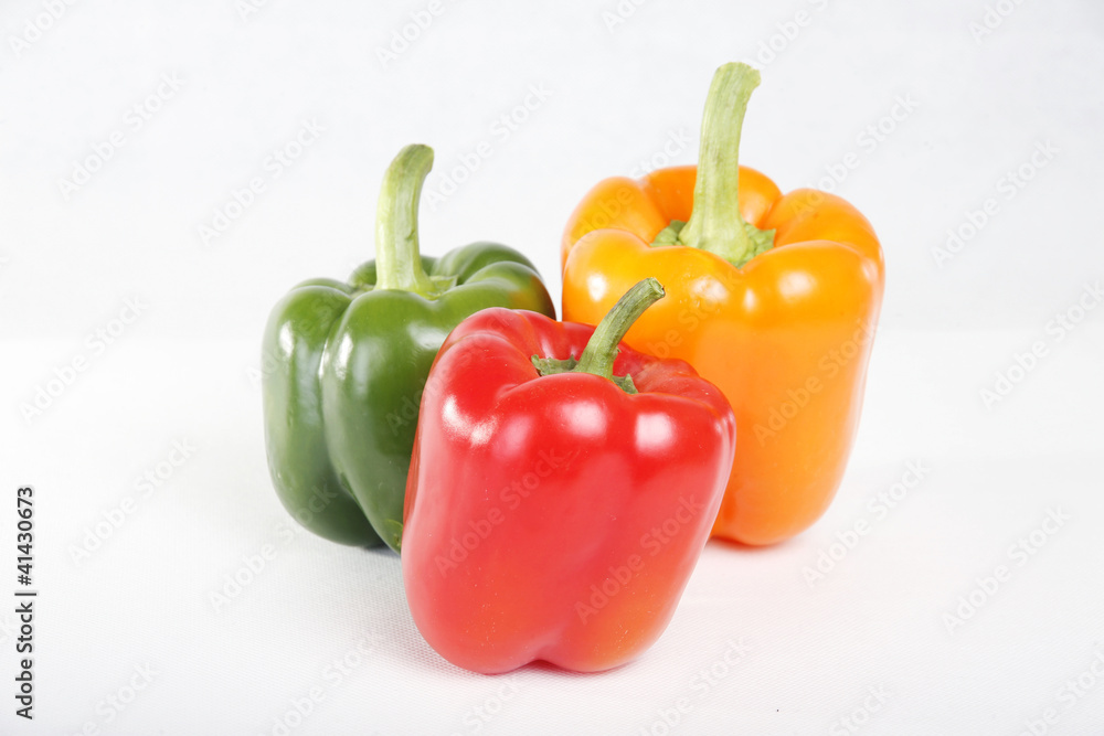 Three color red yellow green peppers in white background Three color red yellow green peppers in white background