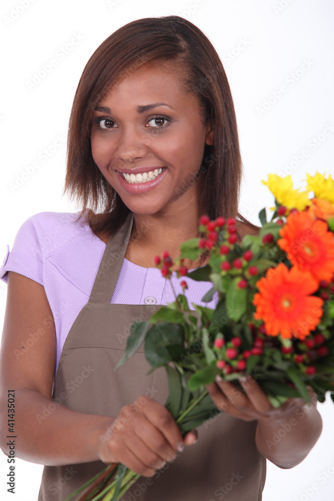 Young florist with a bunch of flowers Young florist with a bunch of flowers