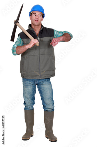 Annoyed man holding axe