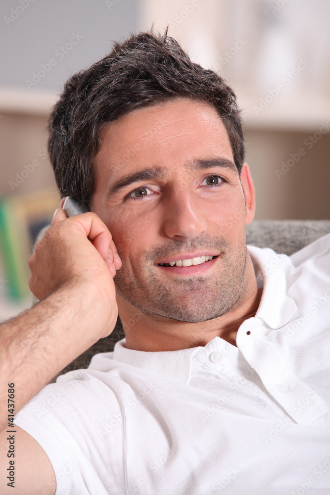 Obraz premium Man at home on a phone call