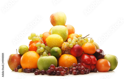 A huge pile of fresh and tasty fruits on a white background