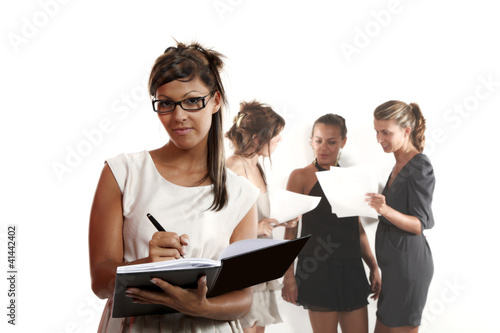 Young businesswomen on white background
