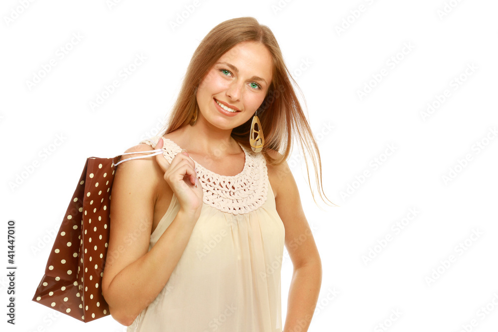 Portrait of a beautiful young woman with a shopping bag