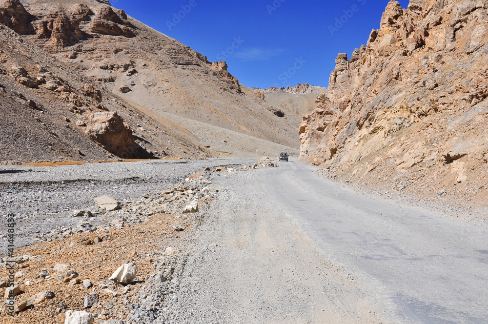 Long damaged asphalt road in Lahul, Himachal Pradesh, India Long damaged asphalt road in Lahul, Himachal Pradesh, India
