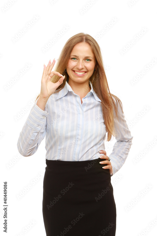 A successful young businesswoman showing ok, isolated on white A successful young businesswoman showing ok, isolated on white