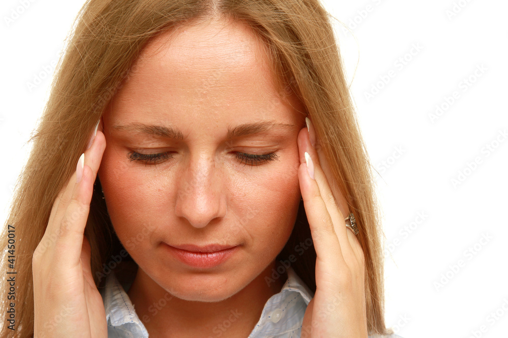 A young businesswoman having a headache A young businesswoman having a headache