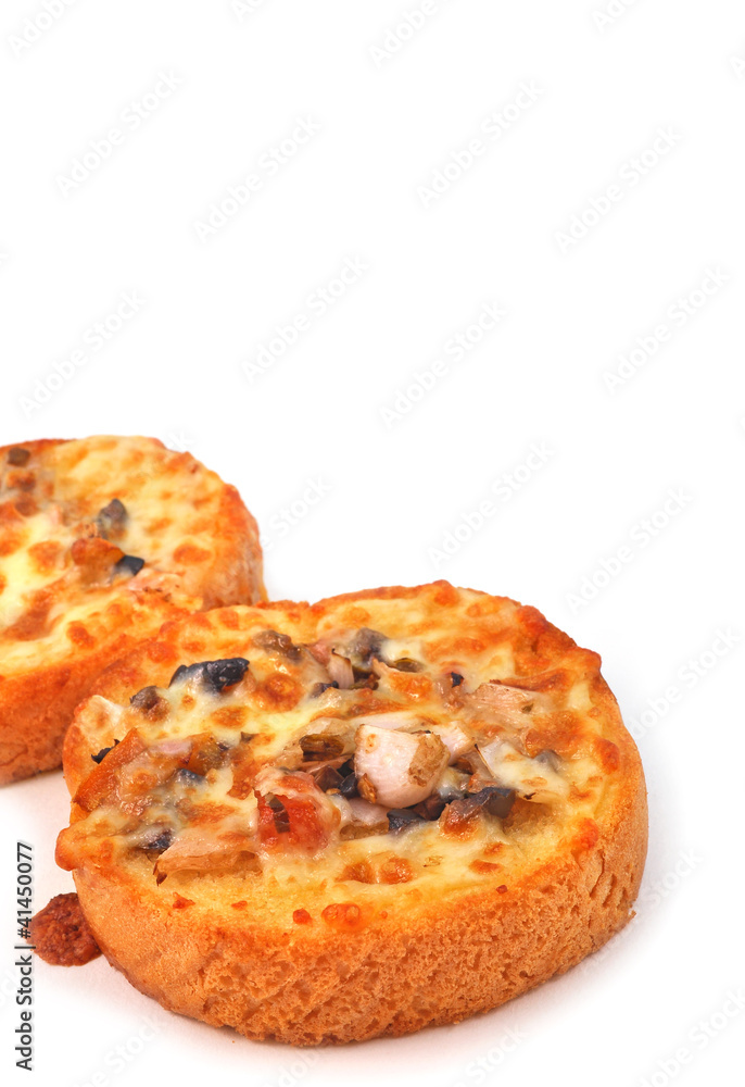 close up of round garlic bread with vegetable toppings close up of round garlic bread with vegetable toppings