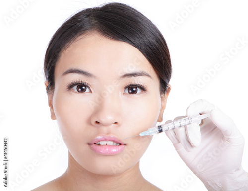 woman receiving a injection in her lip