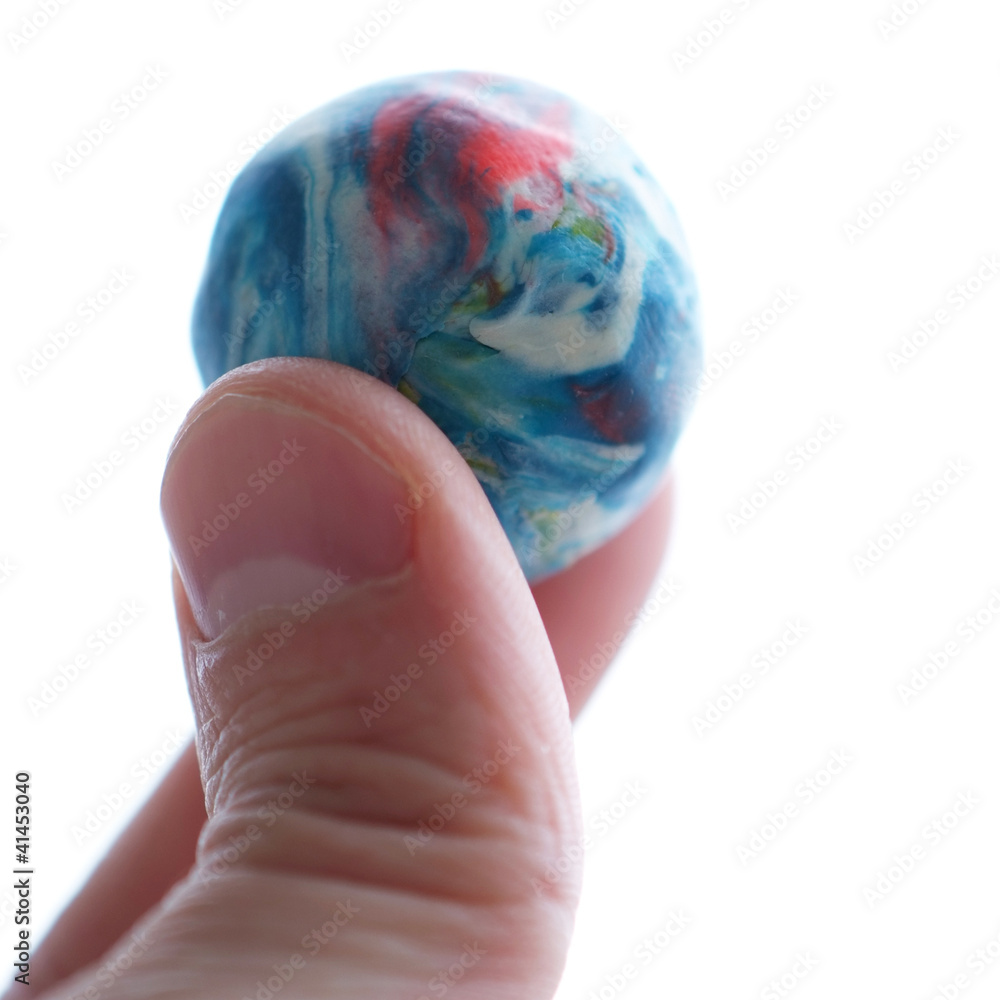 Fototapeta premium Planet in fingers isolated