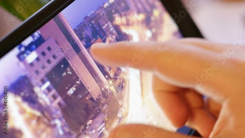 one photograph with a city on digital tablet-pc