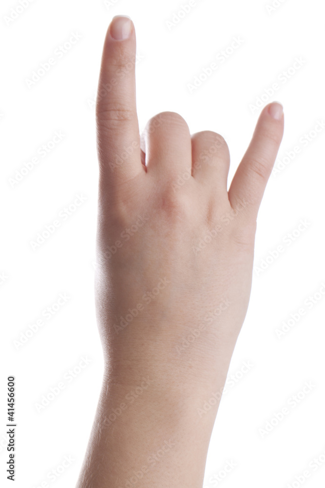 Female hand showing metal sign Female hand showing metal sign